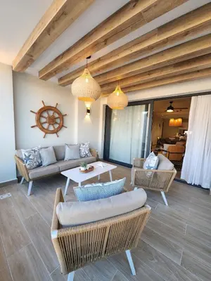 a living room with a couch and chairs and a table at Luxury Beachside Retreat & Private Plunge Pool in Punta Cana