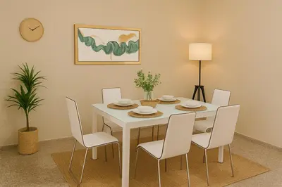 a dining room with a white table and chairs at Relaxing and Serene Guest Room in Cancino