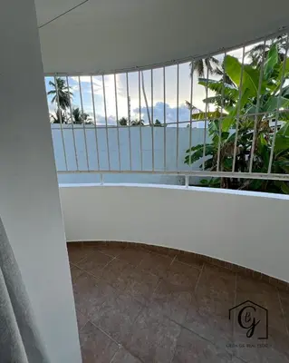 a balcony with a view of the ocean at Tu refugio en Los Corales Punta Cana, wifi rápido y piscina in Punta Cana