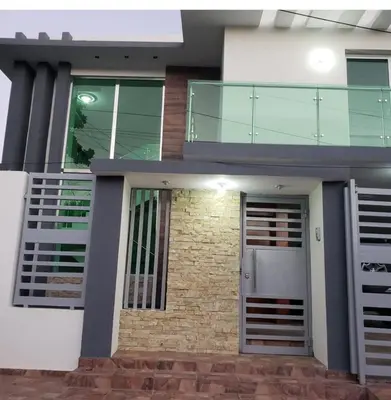 a house with a glass door in front of it at Modern Getaway with Private Pool, Montecristi in Villa Vásquez