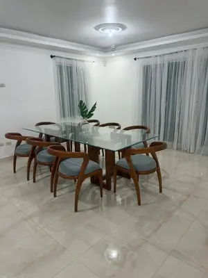 a dining room with a glass table and chairs at Modern Getaway with Private Pool, Montecristi in Villa Vásquez