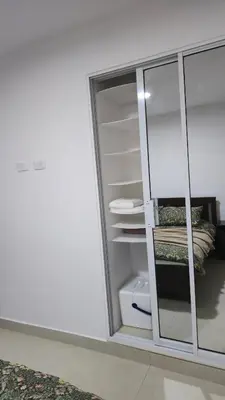 a room with a white cabinet with glass doors at Nuevo Apartamento en Bayahibe in Bayahibe