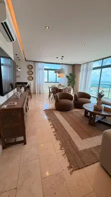 a living room filled with furniture and a large window at Family Friendly Beach Apartment in Juan Dolio in Los Corrales