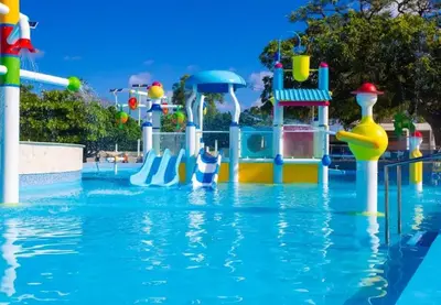a pool at a water park with a water slide at Bubble Glamping, King bed, we have a 8 units like this in Sosúa