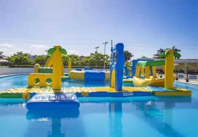 a pool with a water park with a water slide at Bubble Glamping, King bed, we have a 8 units like this in Sosúa