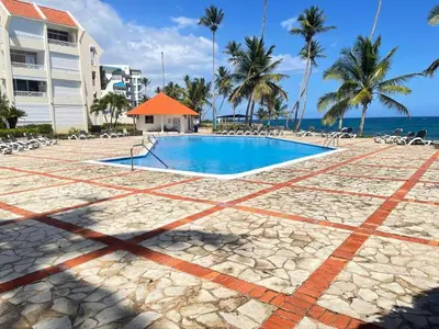 a pool on the beach near a resort at comfortable apartment in La Puntica de Juan Dolio