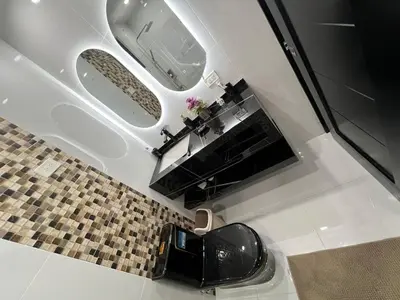 a bathroom with two mirrors and a sink at Villa Joa in Punta Cana