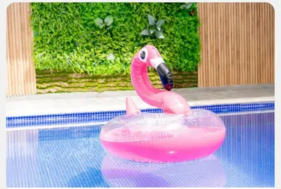 a pink flamingo float in a swimming pool at Villa Joa in Punta Cana