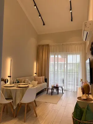 a living room with a table and a couch at 2Bedroom Apt Pool Beach Restaurants in Punta Cana