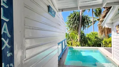 a swimming pool in the side of a house at BEACH FRONT 3 Bedroom Villa with Pool Sleeps 7 in Las Terrenas