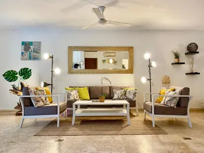 a living room with two couches and a table at BEACH FRONT 3 Bedroom Villa with Pool Sleeps 7 in Las Terrenas