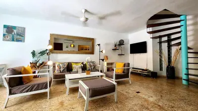 a living room with a couch and a table at BEACH FRONT 3 Bedroom Villa with Pool Sleeps 7 in Las Terrenas