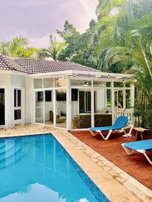 a villa with a swimming pool and a house at Charming 2 bed 2bath villa 77B with private pool in Sosúa