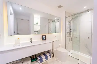 a bathroom with a sink and a toilet and a shower at Vista Relax Golf & Pool View @ Cana Rock Star 210 in Punta Cana