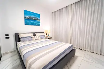 a bedroom with a large bed in a room at Vista Relax Golf & Pool View @ Cana Rock Star 210 in Punta Cana