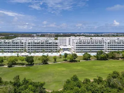 an aerial view of a large white building at Vista Relax Golf & Pool View @ Cana Rock Star 210 in Punta Cana