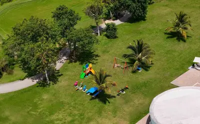 an overhead view of a park with a playground at Vista Relax Golf & Pool View @ Cana Rock Star 210 in Punta Cana