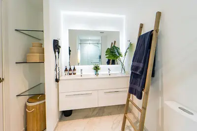a bathroom with a sink and a mirror at Vista Jade Apartamento 2 Hab Vista Picina y Golf in Punta Cana