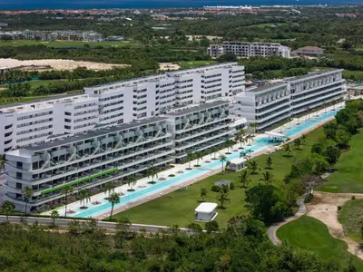 an aerial view of a large apartment building with a swimming pool at Sea Escape Casa Tortuga @ Cana Rock 1 Bdrm Bliss in Punta Cana