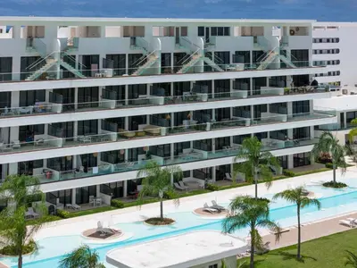 an aerial view of an apartment building with a swimming pool at Sea Escape Casa Tortuga @ Cana Rock 1 Bdrm Bliss in Punta Cana