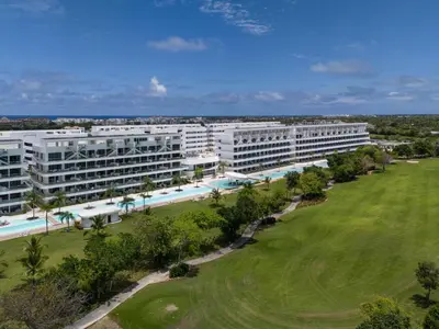 an aerial view of a resort with a golf green at Aqua Fam Swim out Suite - Pool @ Cana Rock G 117 in Punta Cana