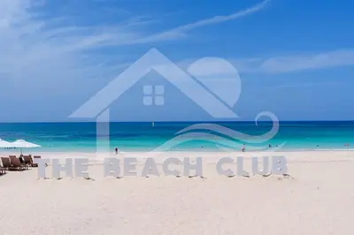 a beach with a sign that reads the beach club at Single Loft Best Pool Views! Cana Rock Star G-205 in Punta Cana