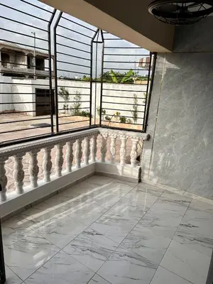 an empty room with a large window and a tile floor at Cozy 2 Bedroom Apartment Boca Chica in Boca Chica