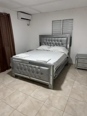 a bed in a bedroom with a metal frame at Apartmento Las Palmeras 1 A1 in Vicente Noble