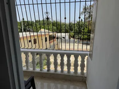 a balcony with a view of a building at Apartmento Las Palmeras 1 A1 in Vicente Noble