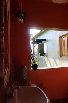 a bathroom with a sink and a mirror at Casba Hostel in Las Terrenas