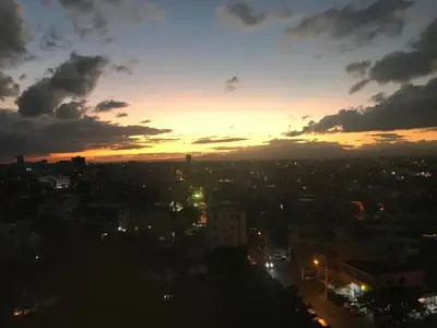 a view of a city at sunset at 3 levels and 5 bedrooms penthouse with a great view in Santo Domingo
