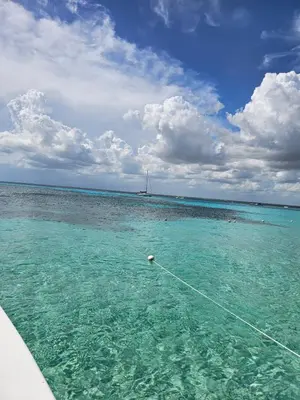 a boat in the water in the ocean at Romana Residence Vacationing Apartment in Cumayasa Kilómetros Diez