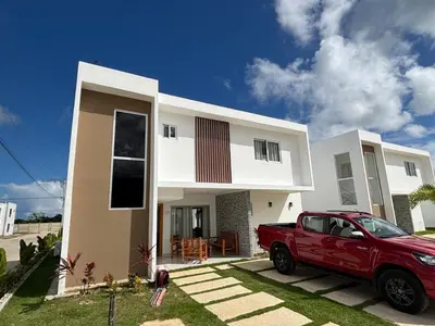 a red truck parked in front of a house at Villa Carpe Diem in Punta Cana