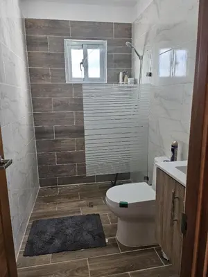 a bathroom with a toilet and a sink at Villa Carpe Diem in Punta Cana