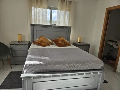 a bedroom with a large bed with two pillows on it at Villa Carpe Diem in Punta Cana