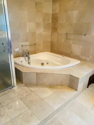 a bath tub in a bathroom with a shower at Vista al mar Hab Privada Larimar, Malecon Santo D in Santo Domingo