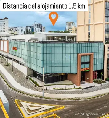 a glass building with a red heart on top of it at Confortable apartamento en Villa Olga in Santiago de los Caballeros