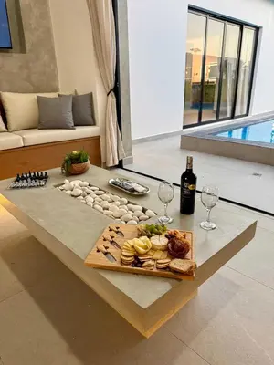 a table with a tray of food and wine glasses at Coral Villa in Oceanfront Comm Sosua Ocean Village in Sosúa