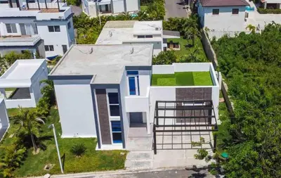 an aerial view of a white house at Sunset Villa in Oceanfront Sosua Ocean Village in Sosúa
