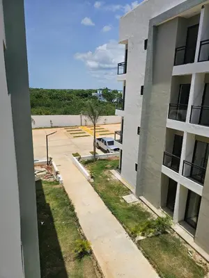 an outside view of a building with a parking lot at Romana Residence Vacationing Apartment in Cumayasa Kilómetros Diez