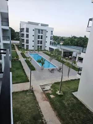 an overhead view of a swimming pool on a building at Romana Residence Vacationing Apartment in Cumayasa Kilómetros Diez