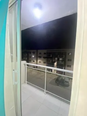 a balcony with a view of a building at Cozy 3br apartment near to airport & beaches in La Cana