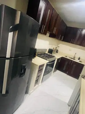 a kitchen with a refrigerator and a stove at Cerca del aeropuerto los frailes I in Los Frailes