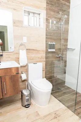 a bathroom with a toilet and a shower at La Isla Royal - Abismo Celeste in Miches