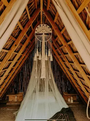 a chandelier hanging from the ceiling of a tent at OYA New Earth Luxury Romantic Glamping with Private Outdoor Bath in Jamao al Norte