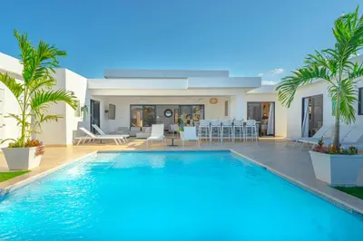 a swimming pool in front of a villa at Kcasama Castle Villa 1108 in Sosúa