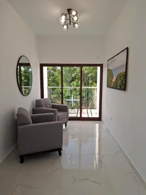 a living room with two couches and a large window at Hermosa villa familiar cucu's home beach in Río San Juan