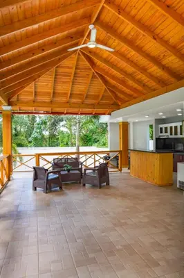 a large living room with a wooden ceiling at Villa my place in Bonao