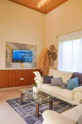 a living room with a couch and a table at Villa my place in Bonao