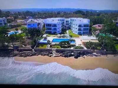 an aerial view of a resort next to the beach at Luxury Oceanfront Condo in Sosúa